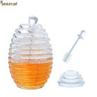 Due tipi vaso e cucchiaio trasparenti del miele dell'ape con la mescolatura barattolo di cristallo del miele di Rod di mini