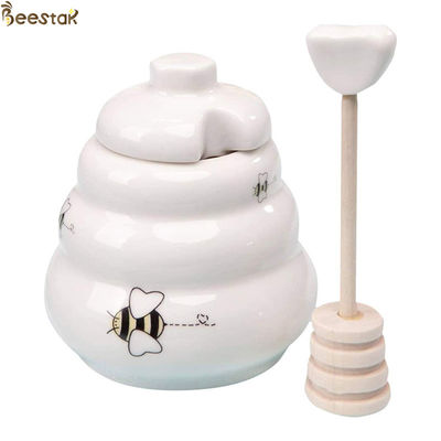 Honey Jar Ceramic Honey Pot vuoto bianco all'ingrosso con il merlo acquaiolo di legno per stoccaggio del miele