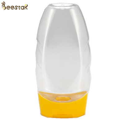 Prezzo franco fabbrica di plastica Honey Jar And Spoon di plastica speciale 335ml del commestibile vuoto